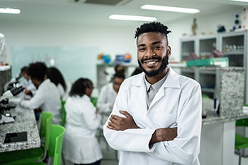 Smiling teacher at the front of the classroom