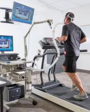 A picture of a man running on a treadmill.