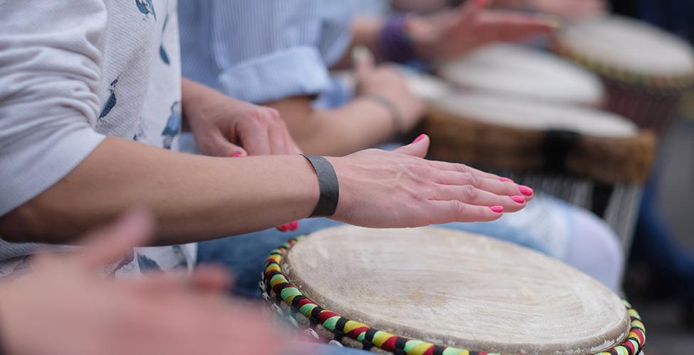 People playing hand drums