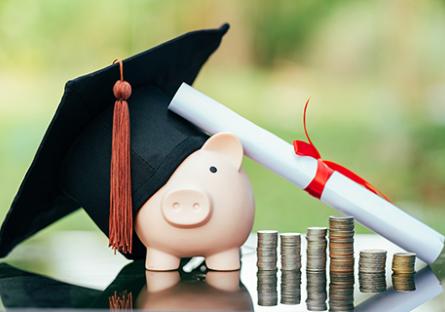 Piggy bank with graduation cap