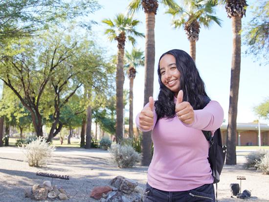 Student giving a thumbs up