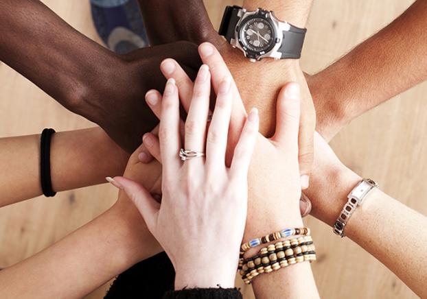 Group with hands together